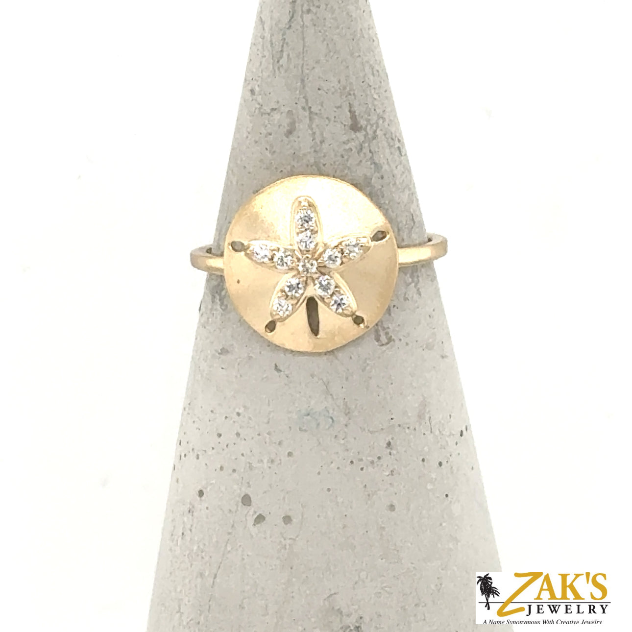 14K yellow gold ring with brushed sand dollar motif and diamond accents.
