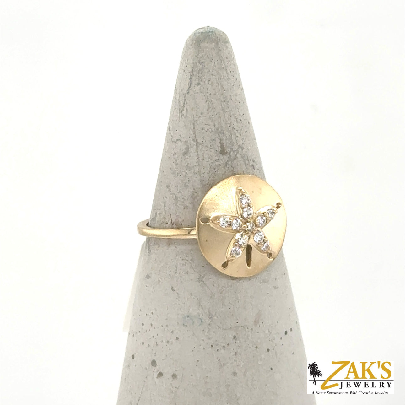 14K yellow gold ring with brushed sand dollar motif and diamond accents.