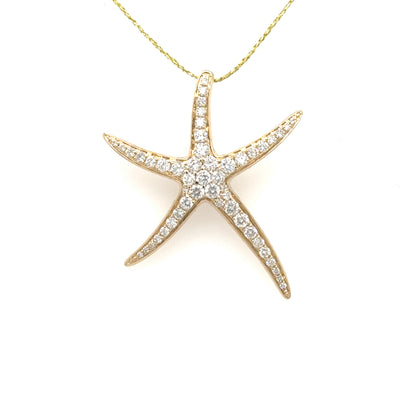14K yellow gold starfish pendant pavé-set with round diamonds, hidden bail.