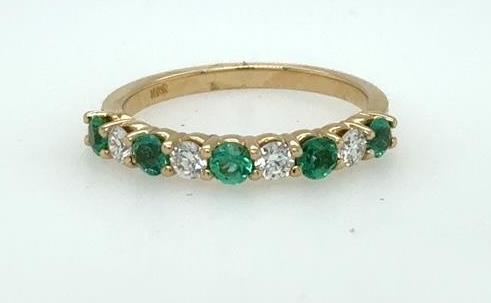 14K yellow gold band with alternating round emeralds and diamonds in shared prongs.