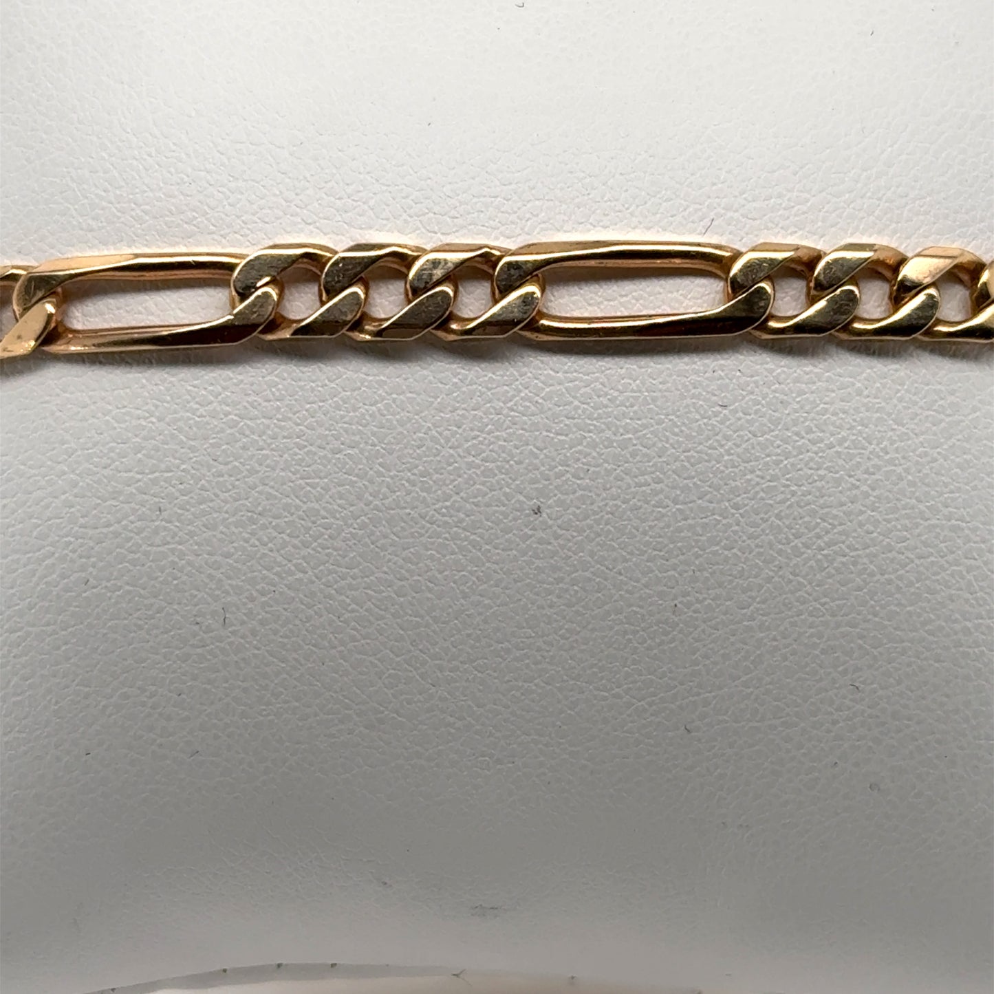 14K yellow gold Figaro bracelet with alternating elongated and curb links.