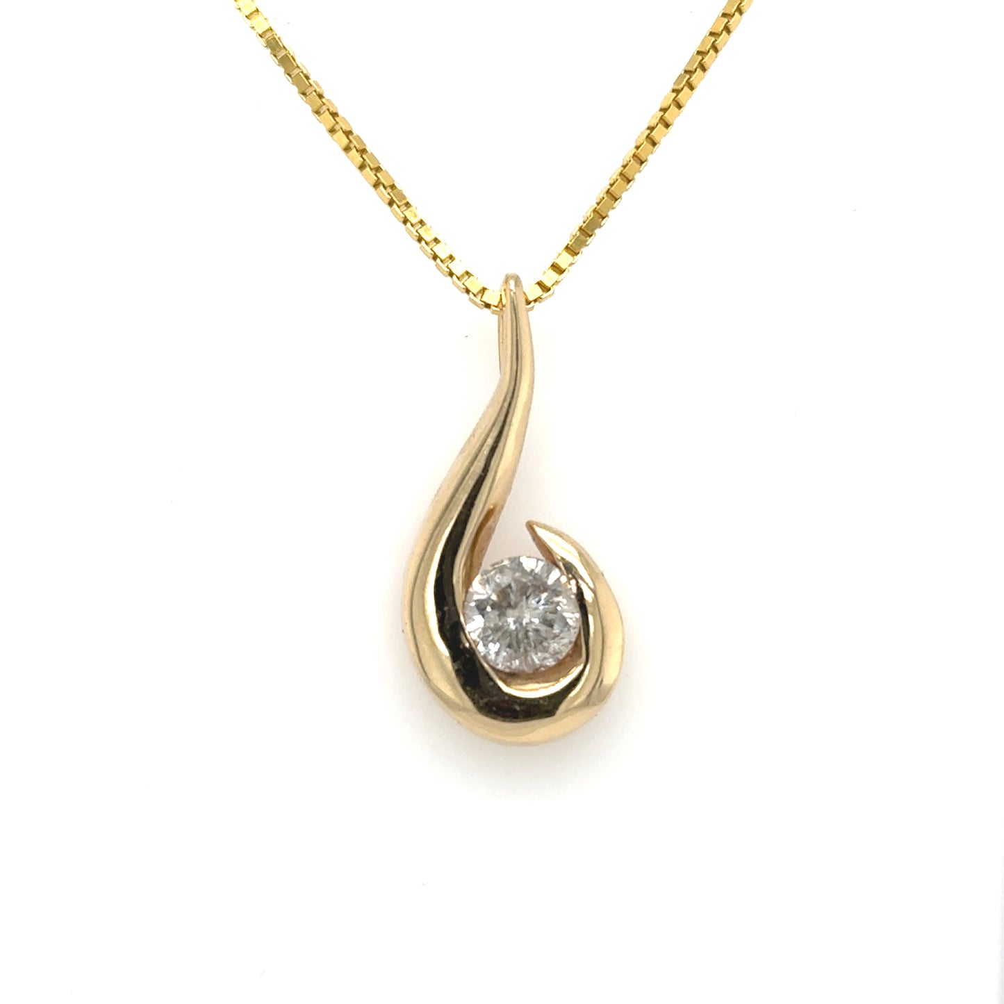 14K yellow gold freeform pendant with round diamond in half-bezel, hidden bail.