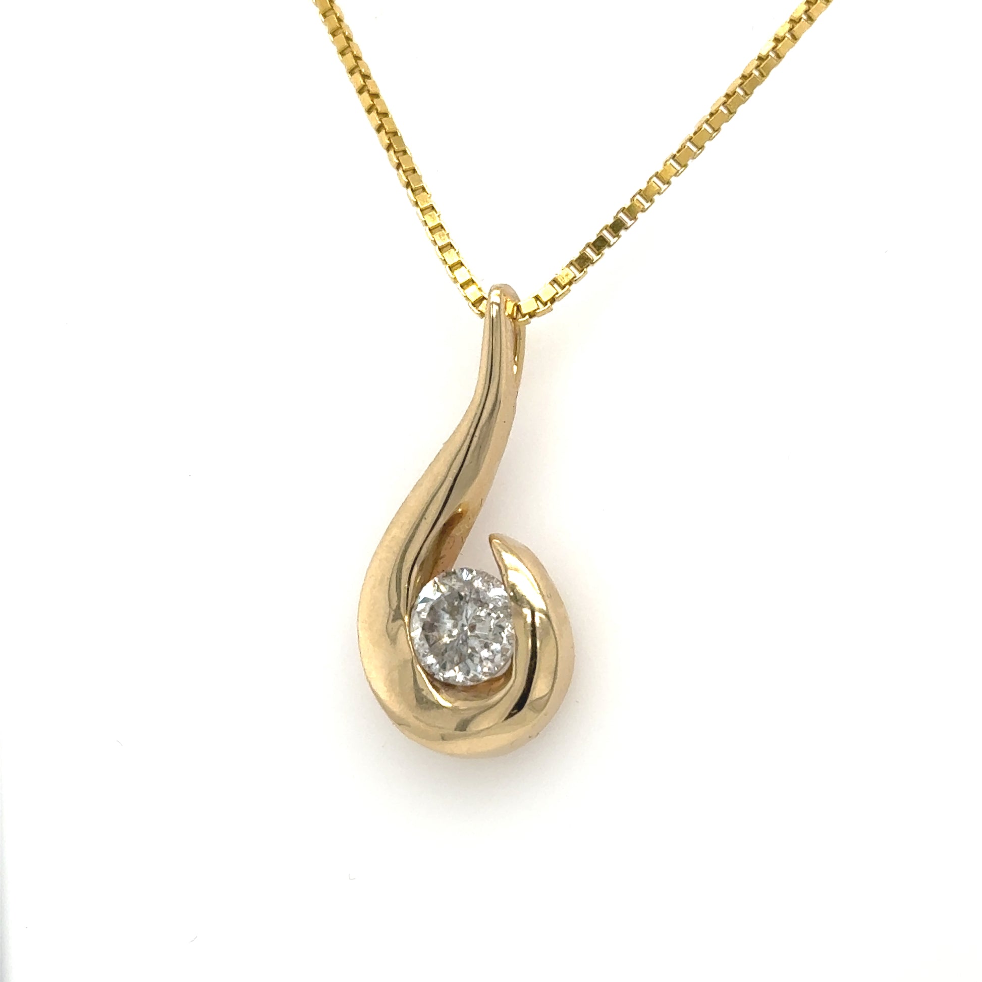 14K yellow gold freeform pendant with round diamond in half-bezel setting.