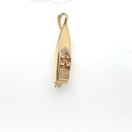 14K yellow gold speedboat pendant with diamond accents and a fixed bail.