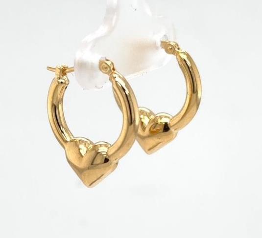 14K yellow gold hoop earrings with puffed heart centers and post backs.