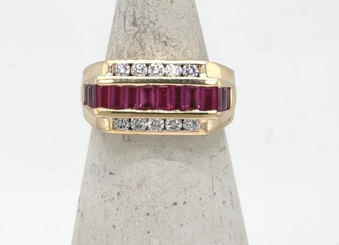 14K yellow gold ring with channel-set baguette rubies flanked by round diamonds.
