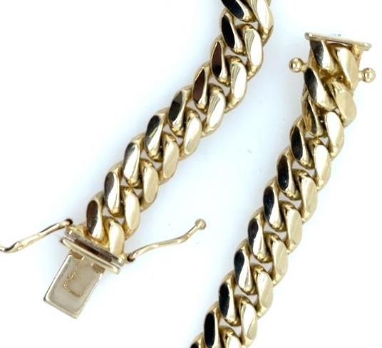 14K yellow gold Miami Cuban link bracelet with box clasp and safety locks.