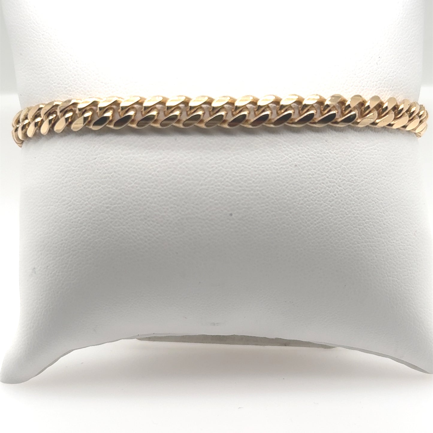 14K yellow gold Miami Cuban link bracelet with flat, closely interlocking links.