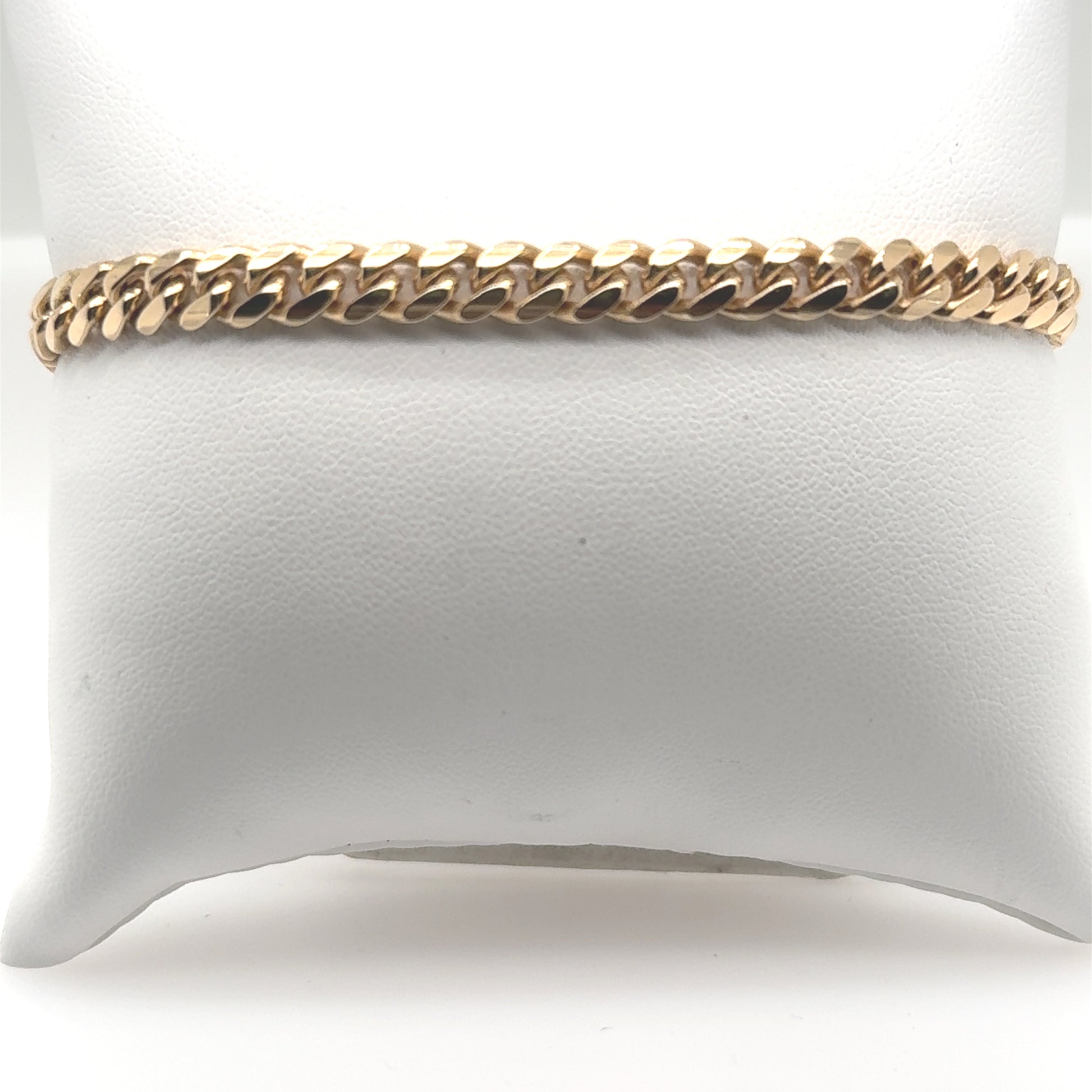 14K yellow gold Miami Cuban link bracelet with flat, closely interlocking links.
