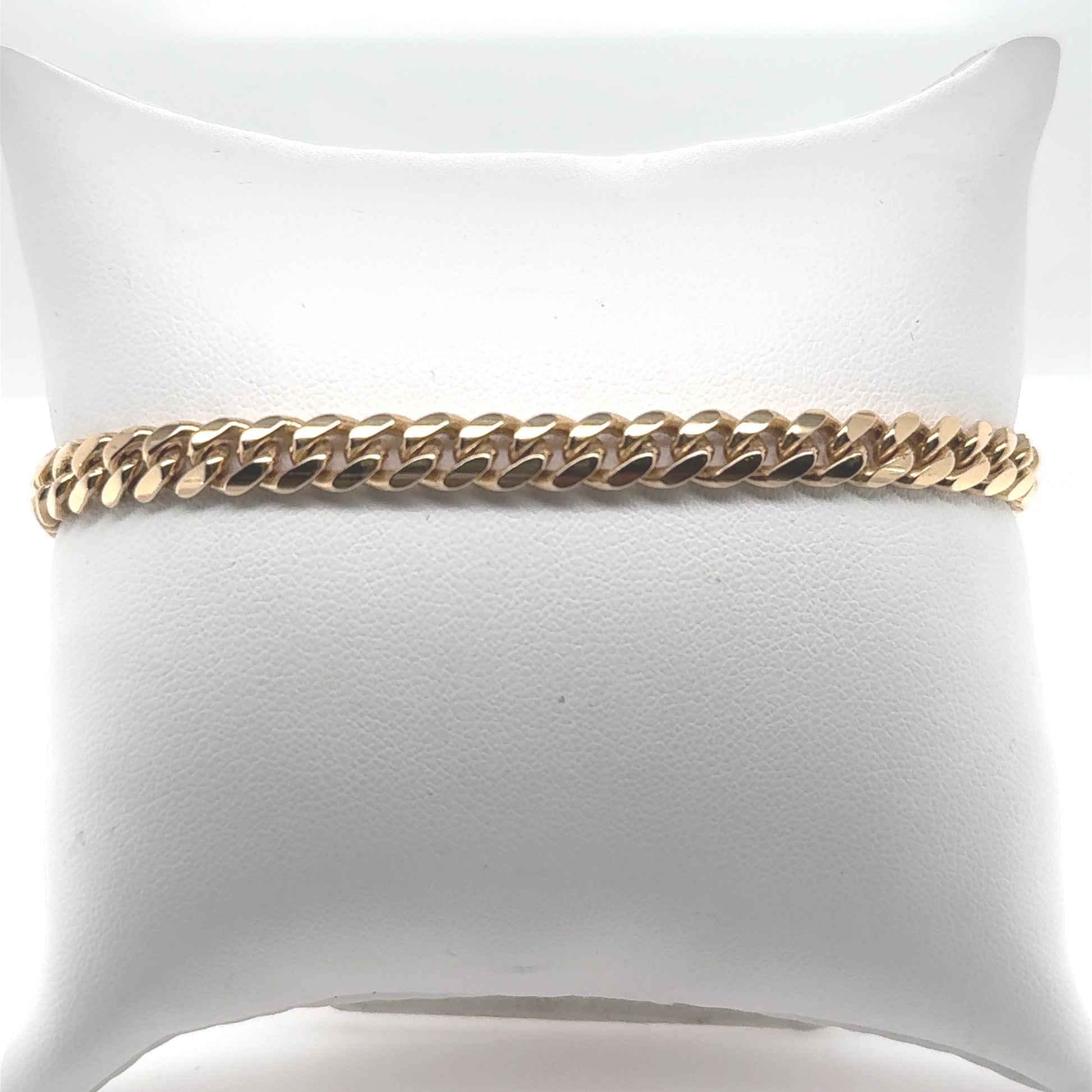 14K yellow gold Miami Cuban link bracelet with box clasp and safety.