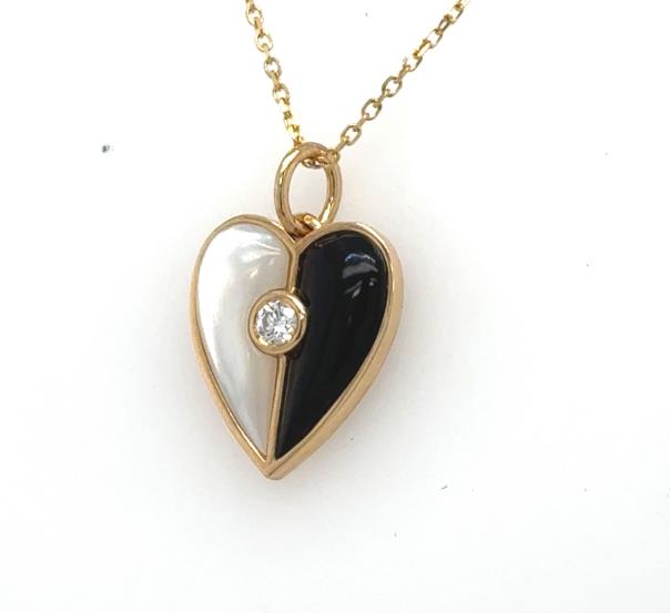 14K yellow gold heart pendant with mother‑of‑pearl and onyx halves, bezel‑set diamond.
