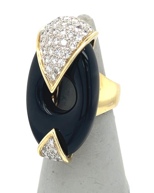 14K yellow gold ring with oval black onyx and pavé diamond chevron tips.