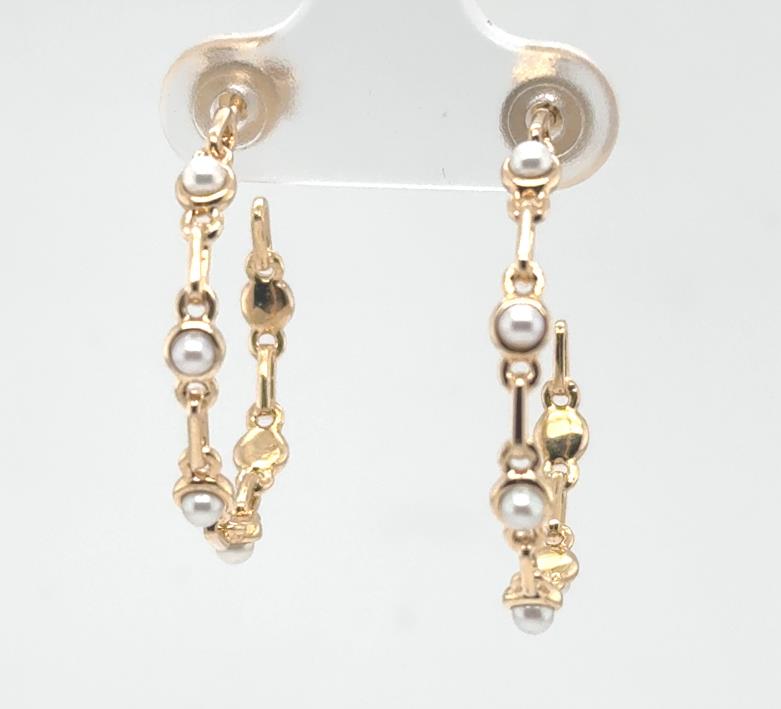 14K yellow gold hoop earrings with round white freshwater pearls and friction posts.