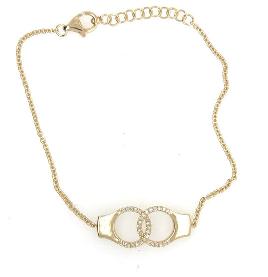 14K yellow gold bracelet with diamond pavé interlocking handcuff motif and lobster clasp.
