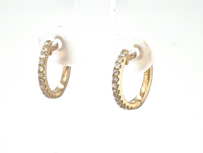 Small 14K yellow gold huggie hoops with prong-set round diamond fronts.