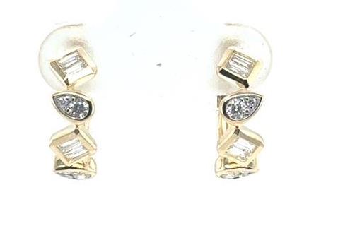 14K yellow gold huggie earrings with baguette and pear-shaped diamond stations.