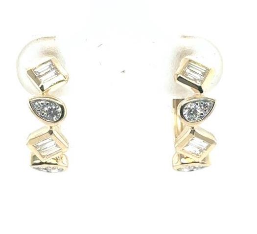 14K yellow gold huggie earrings with alternating baguette and pear-shaped diamonds.