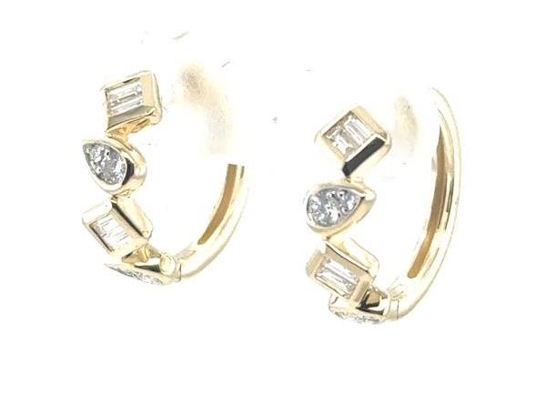 14K yellow gold huggie earrings with alternating baguette and pear-shaped diamonds.