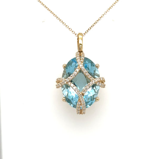 Oval Swiss blue topaz pendant with diamond lattice in 14K yellow gold.