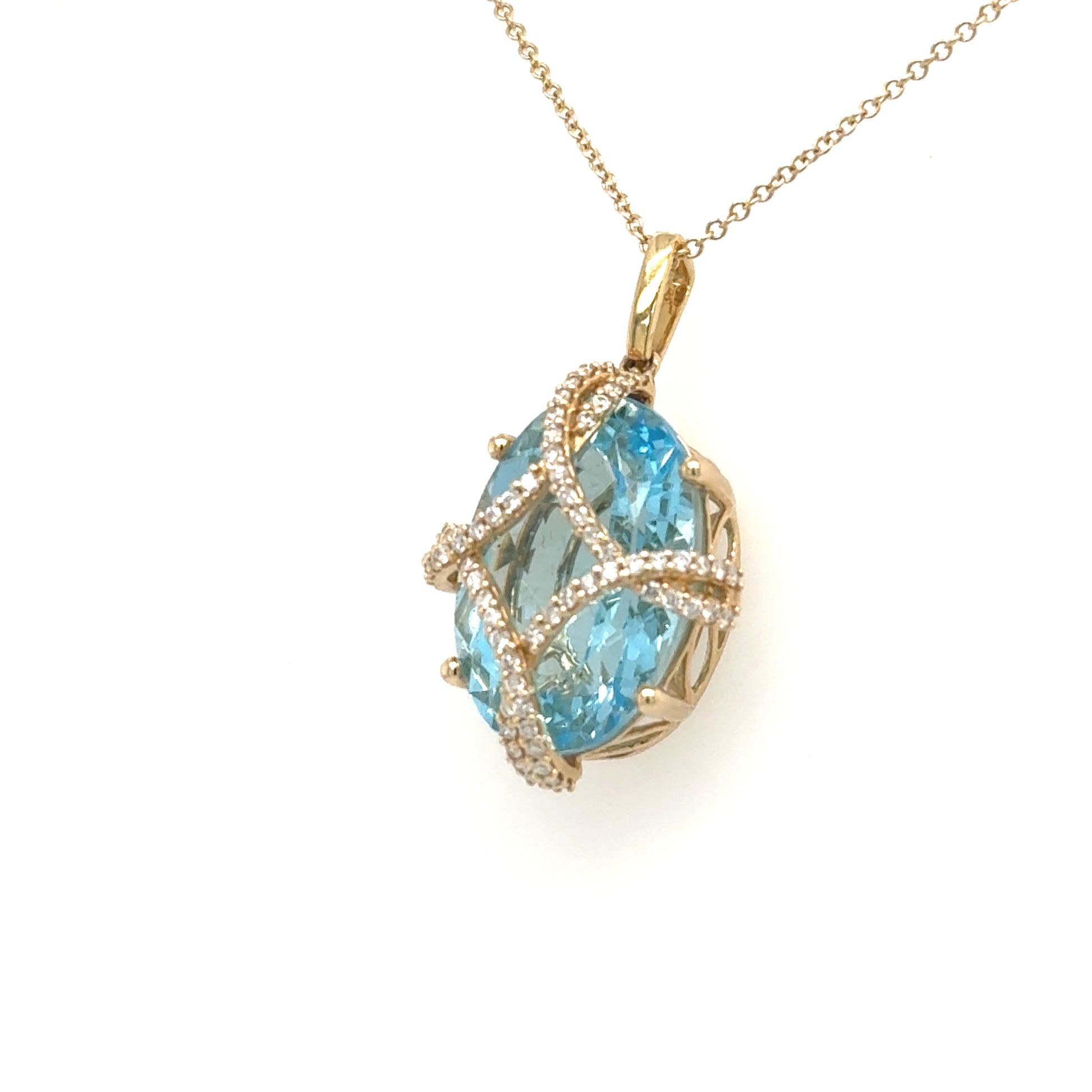 14K yellow gold pendant with oval Swiss blue topaz and diamond lattice cage.