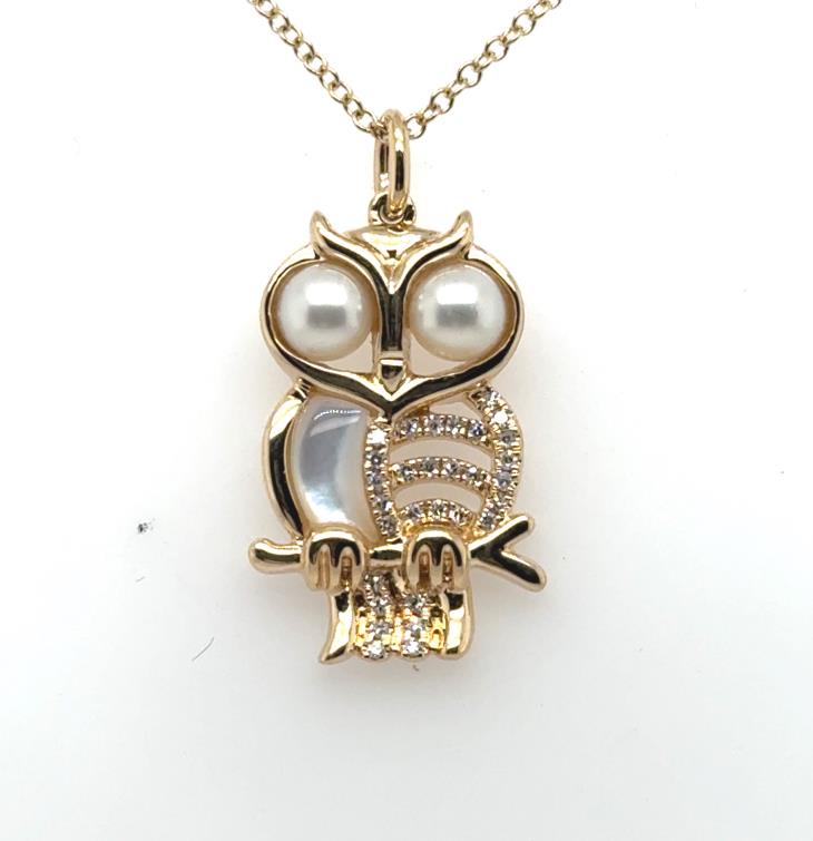 14K yellow gold owl pendant with pearl eyes, mother-of-pearl and diamond accents.