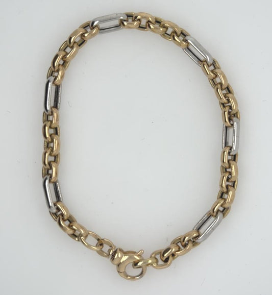 14K yellow and white gold Figaro-style cable bracelet with lobster clasp.