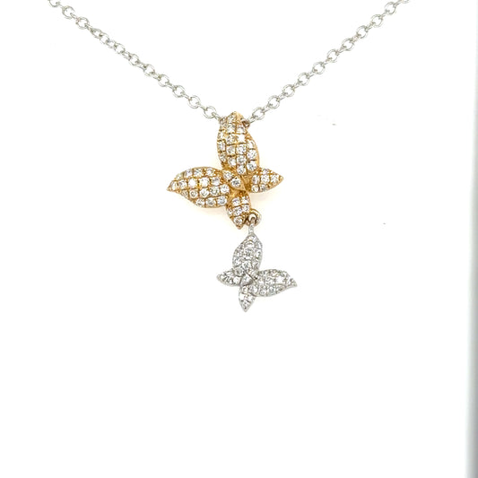 Two diamond-pavé butterfly pendants in yellow and white gold on a white gold chain.