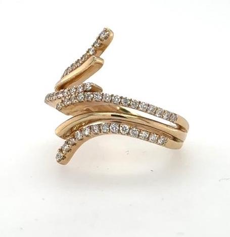 14K yellow gold bypass ring with curved split bands and pavé-set diamonds.