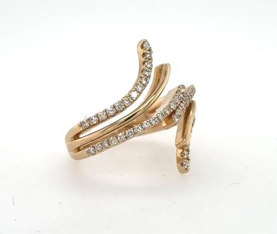 14K yellow gold bypass ring with curved split bands pavé-set with diamonds.