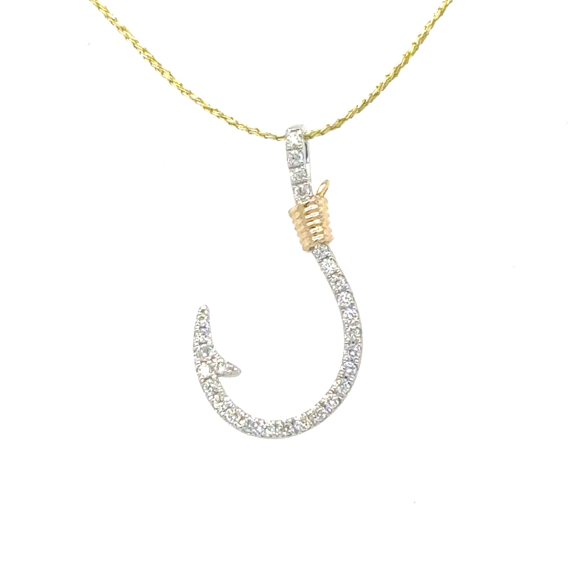 Diamond-pavé fishhook pendant in white gold with yellow gold wrapped accent.