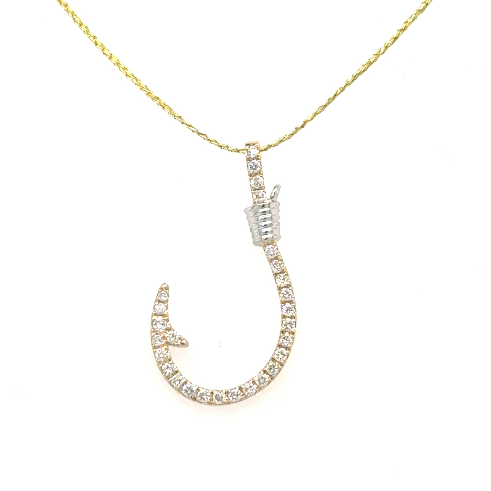 Diamond-studded fishhook pendant in 14K white and yellow gold with wrapped accent.