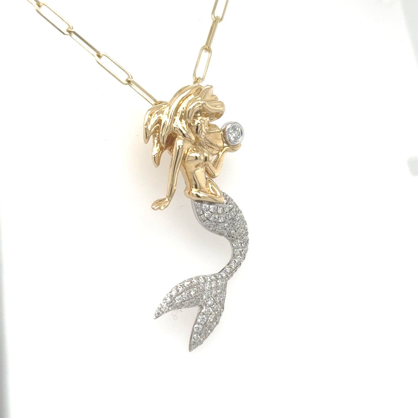 14K yellow and white gold mermaid pendant with pavé diamond tail and bezel-set diamond.