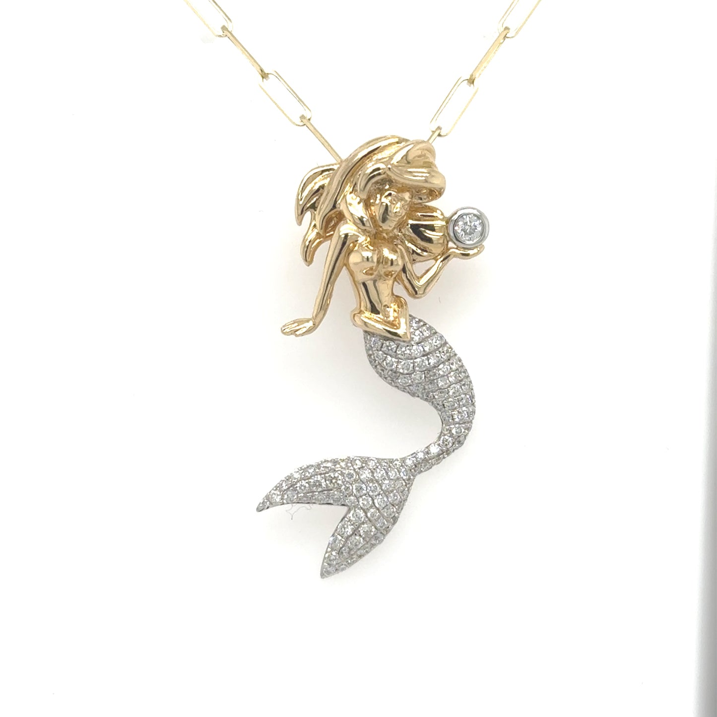 14K yellow and white gold mermaid pendant with pavé diamond tail and bezel-set diamond.