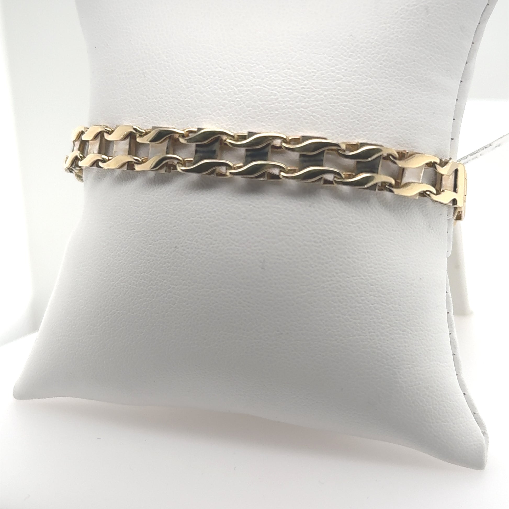 14K yellow and white gold railroad link bracelet with lobster clasp.
