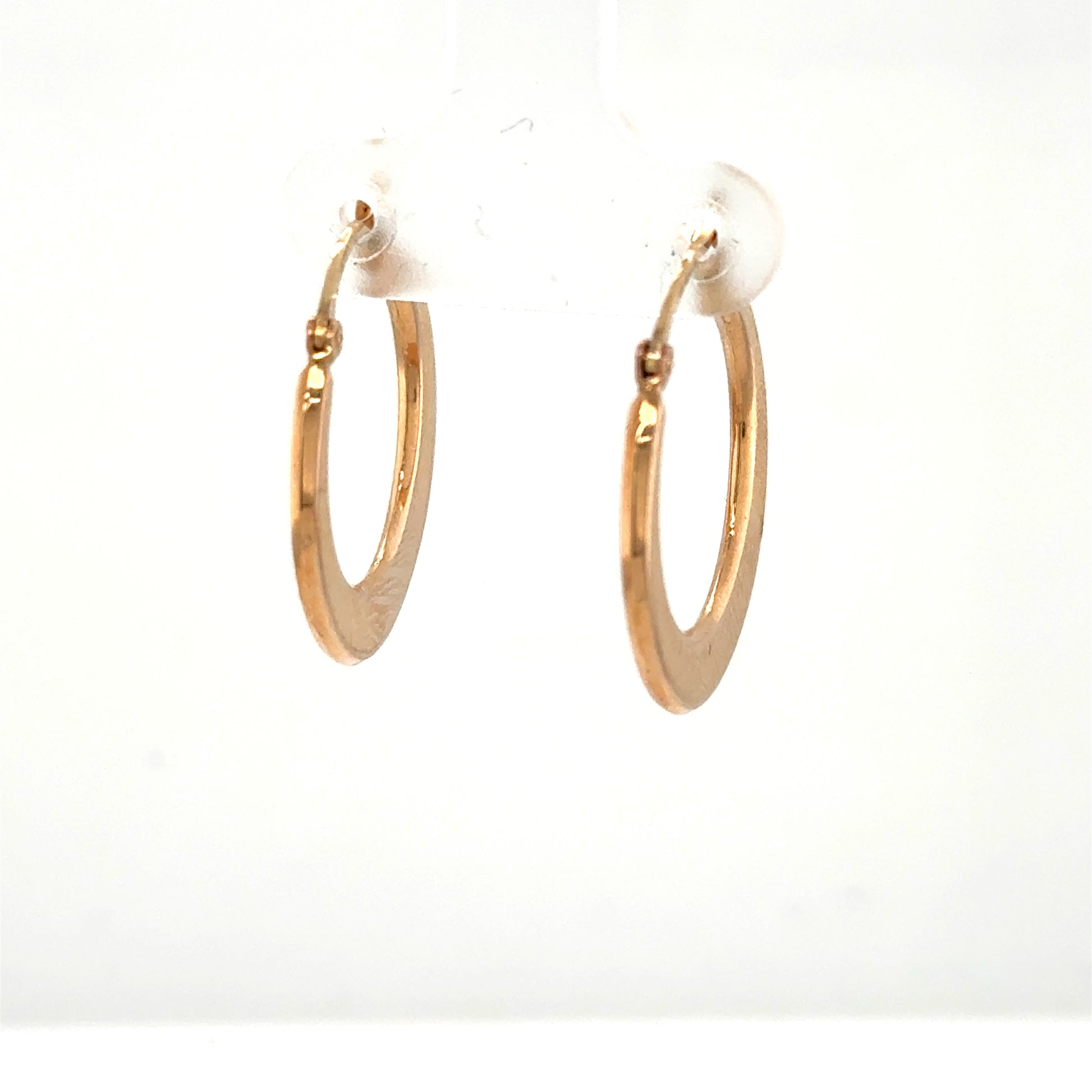 Small 14K rose gold hoop earrings with flat tapered tubing and latch backs.