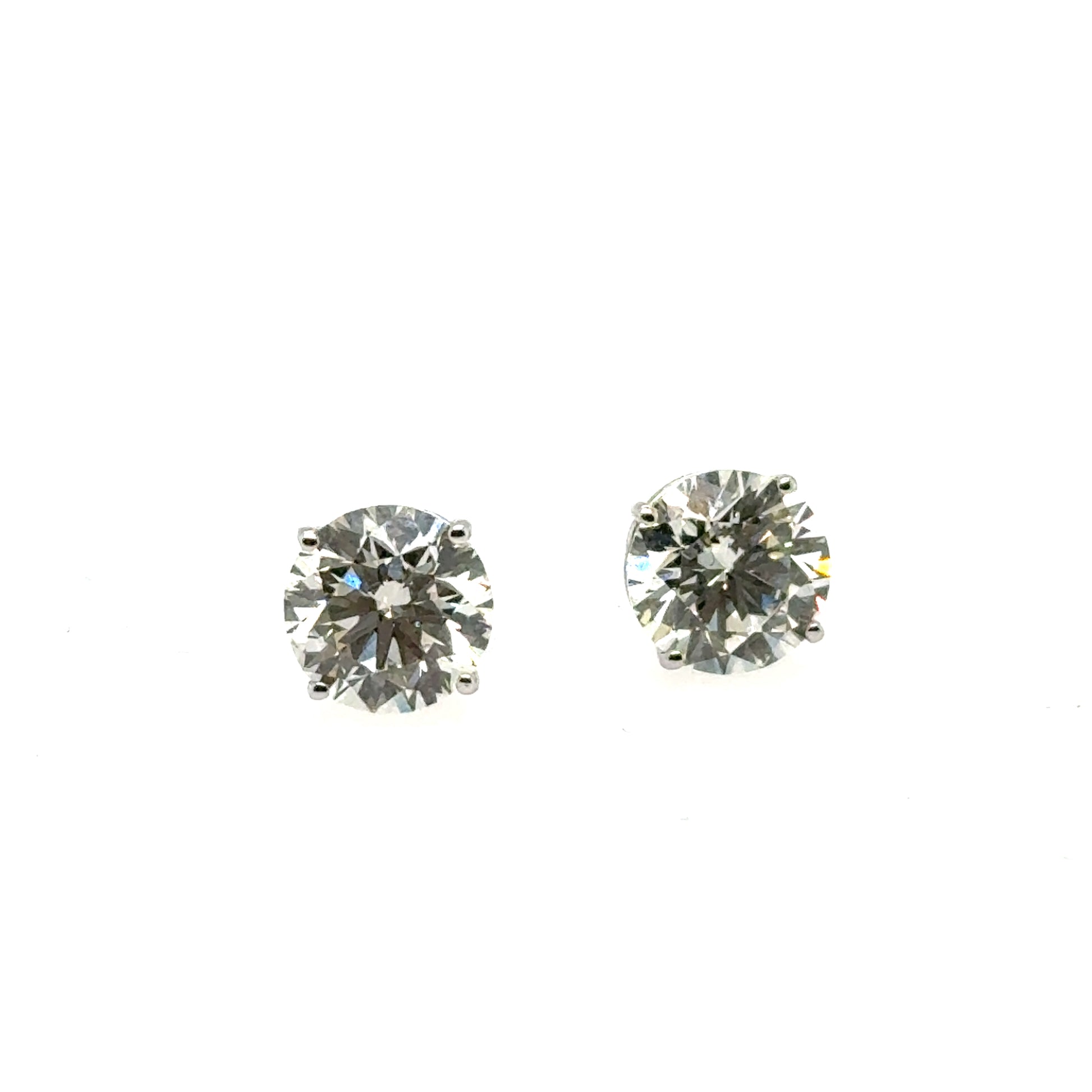 Round lab-grown diamond stud earrings in white gold four-prong basket settings.