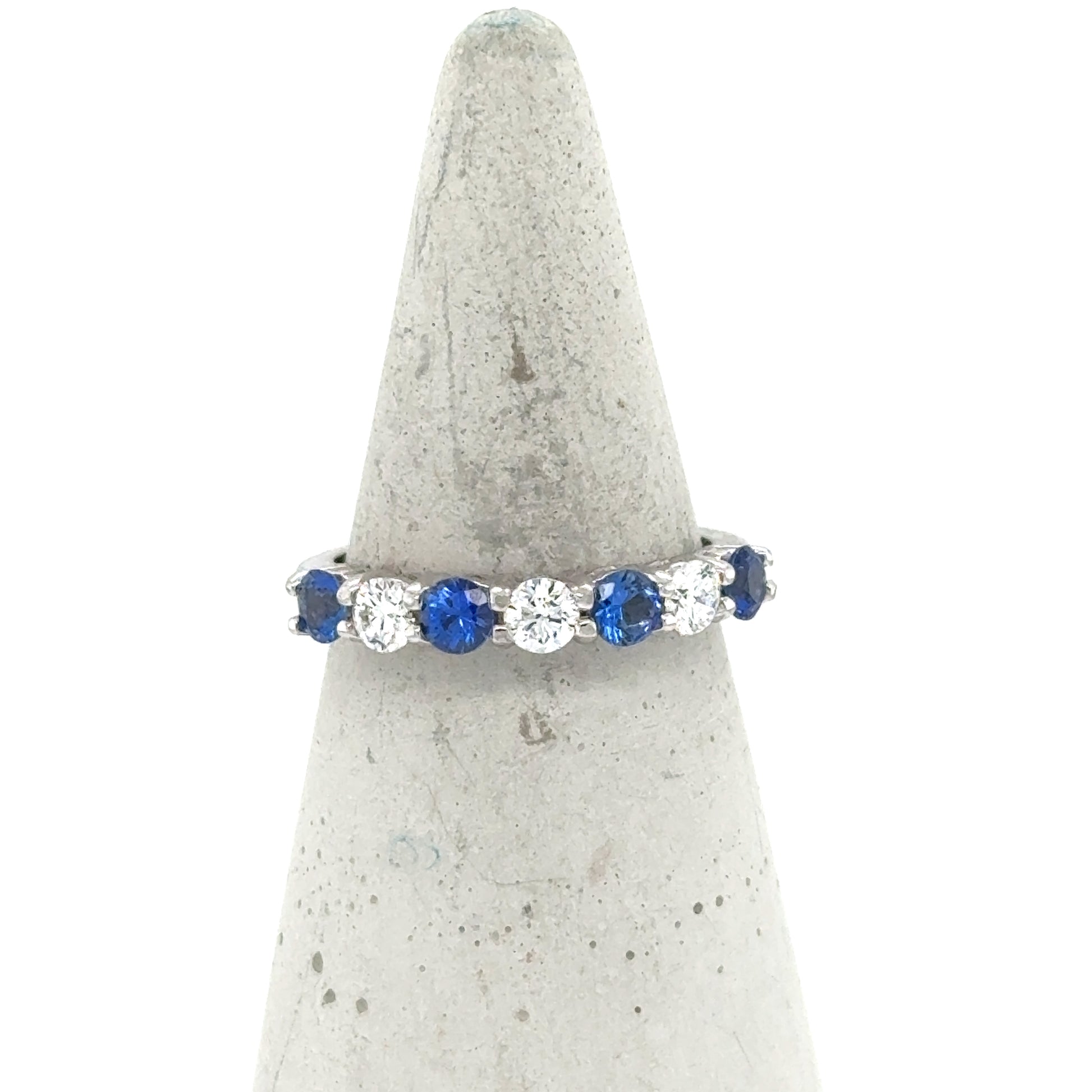 14K white gold band with alternating round blue sapphires and white diamonds.