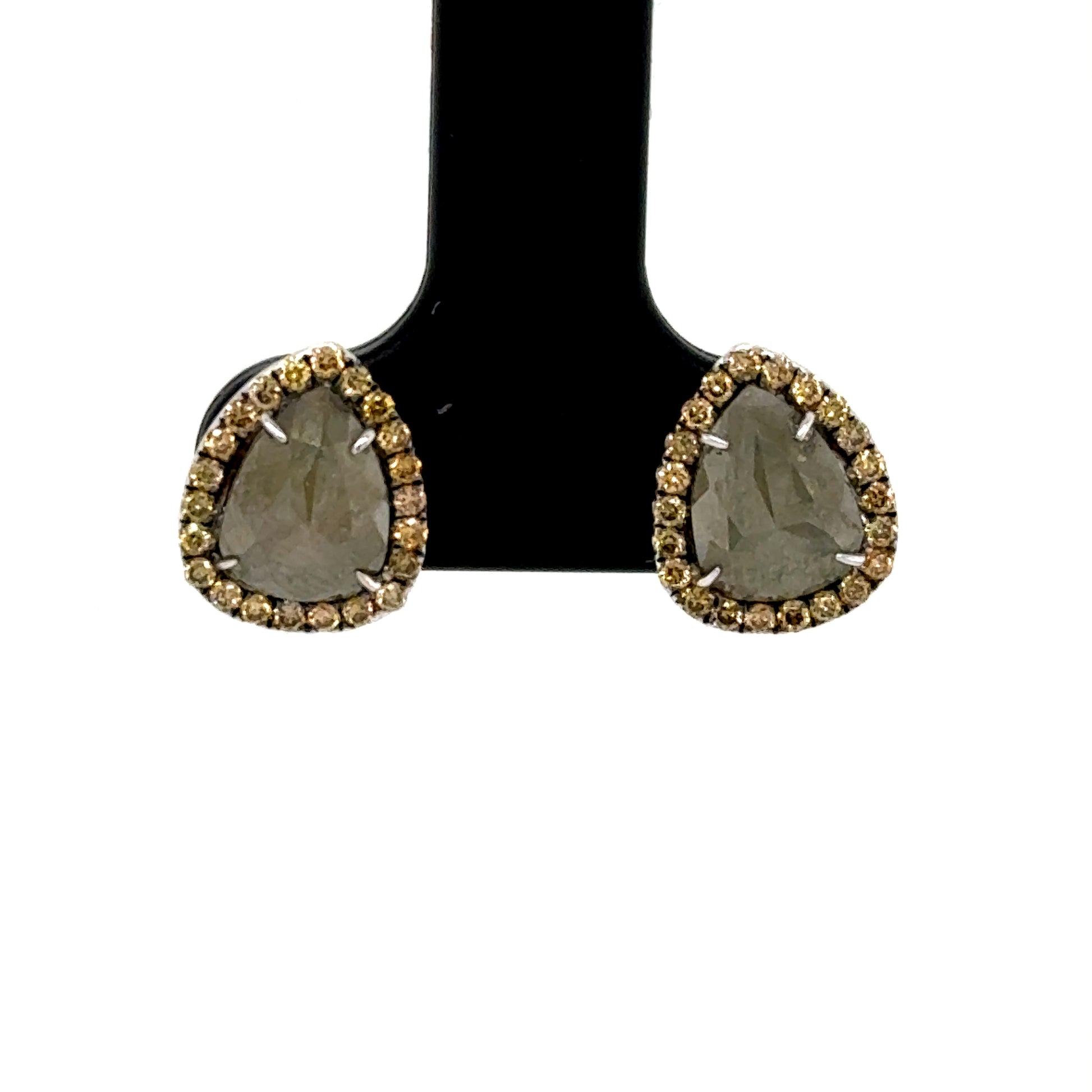 14K white gold stud earrings with pear-shaped slice diamonds and halo accents.