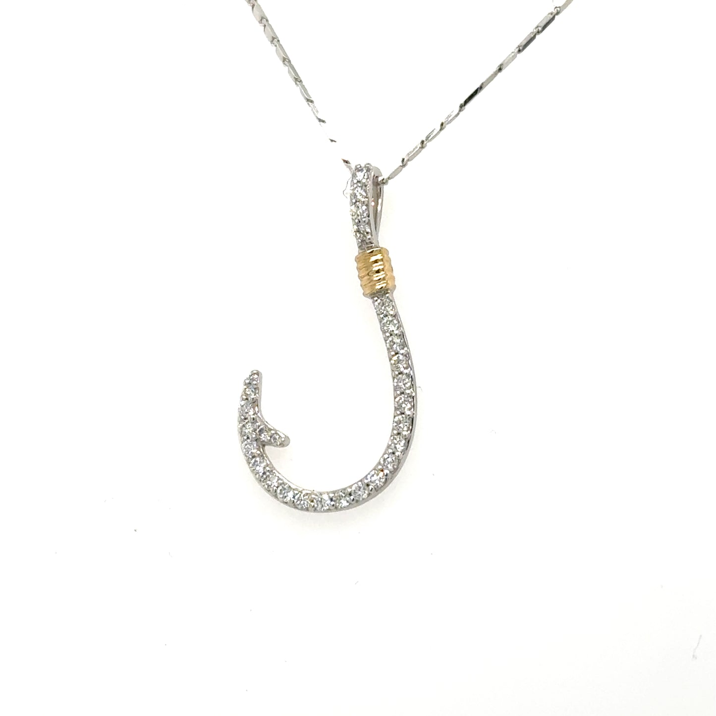 14K white gold diamond fish hook pendant with yellow gold wrapped accent.