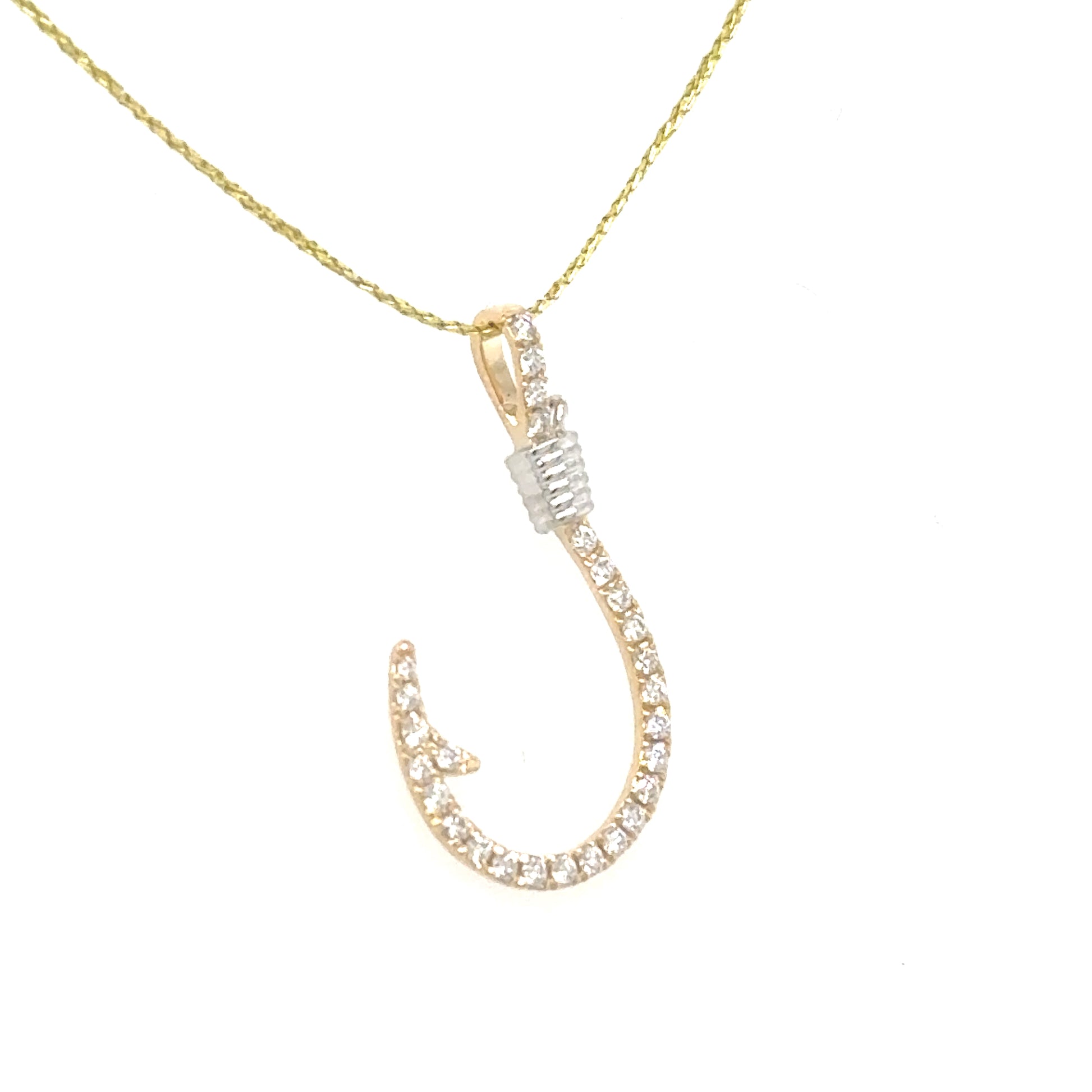 14K yellow and white gold fishhook pendant set with small round diamonds.