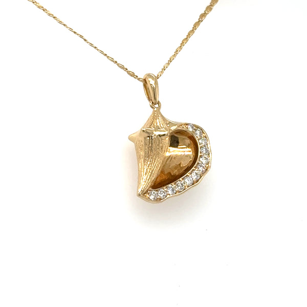 14K yellow gold conch shell pendant with diamond pavé edge on chain.