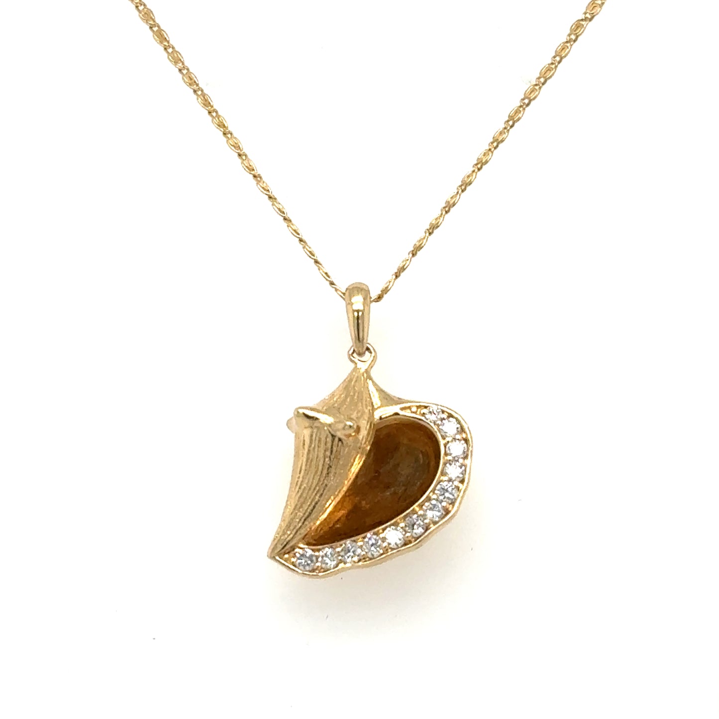 14K yellow gold conch shell pendant with pavé diamonds on serpentine chain.