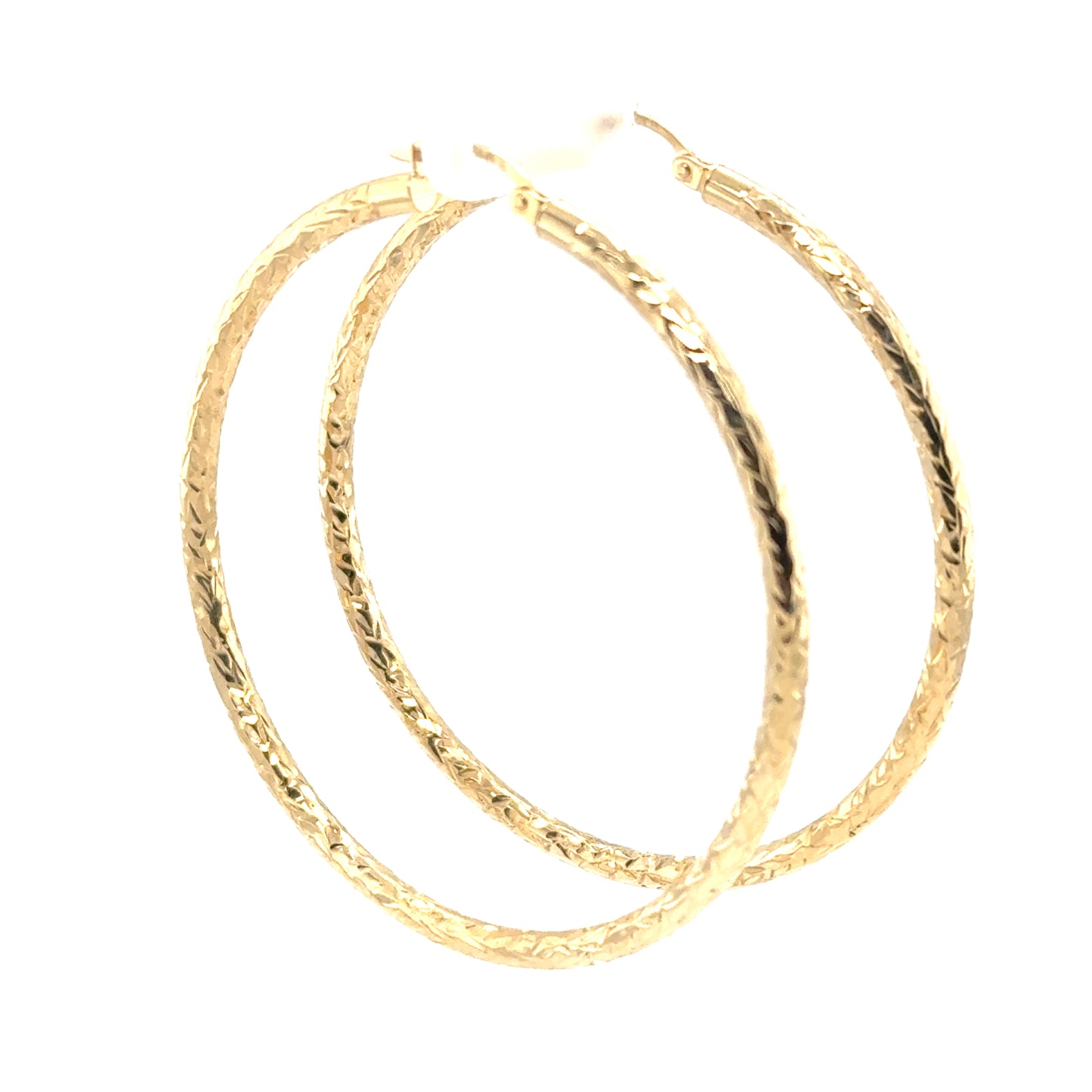 Extra large 14K yellow gold hoop earrings with diamond-cut textured tubes.