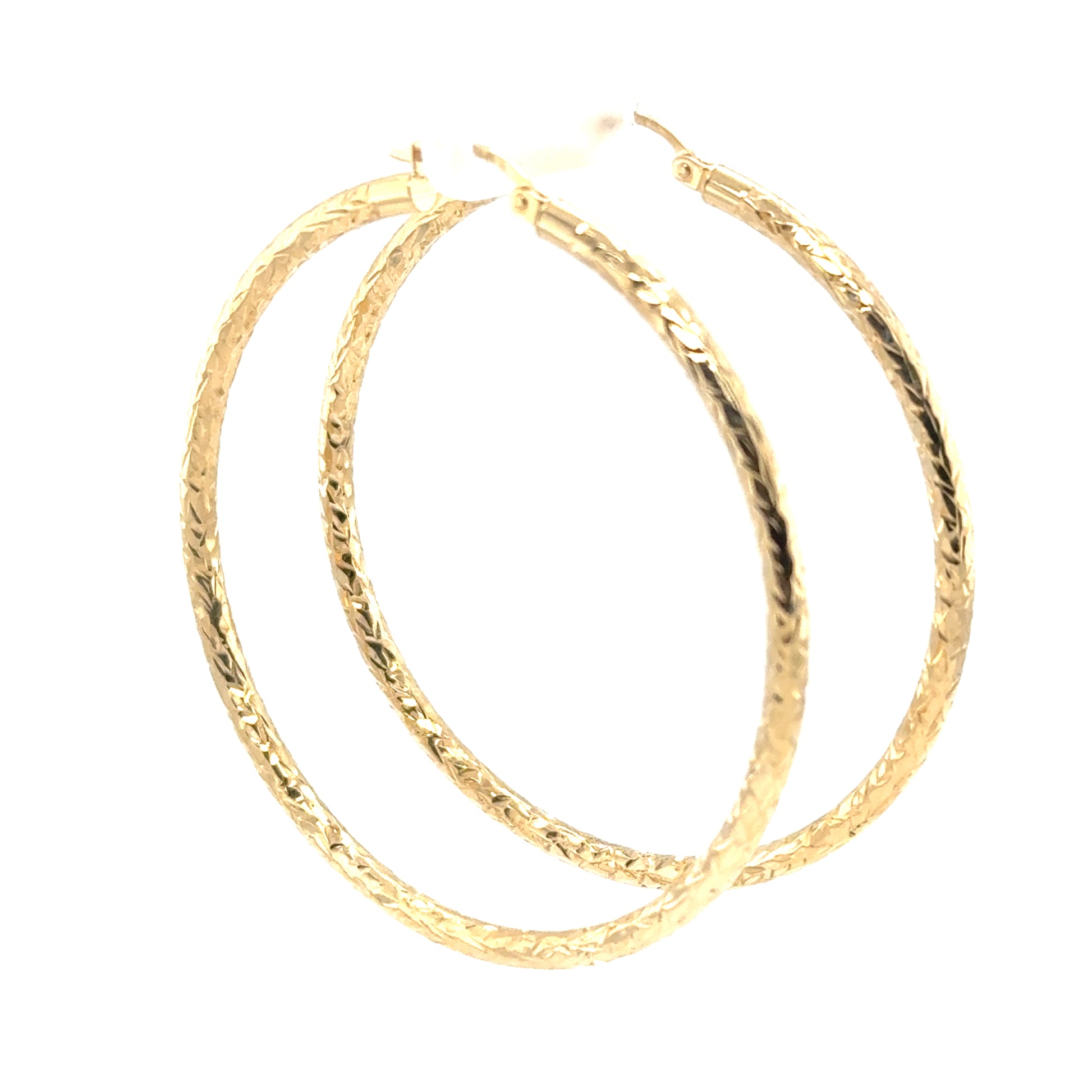 Extra large 14K yellow gold hoop earrings with diamond-cut textured tubes.