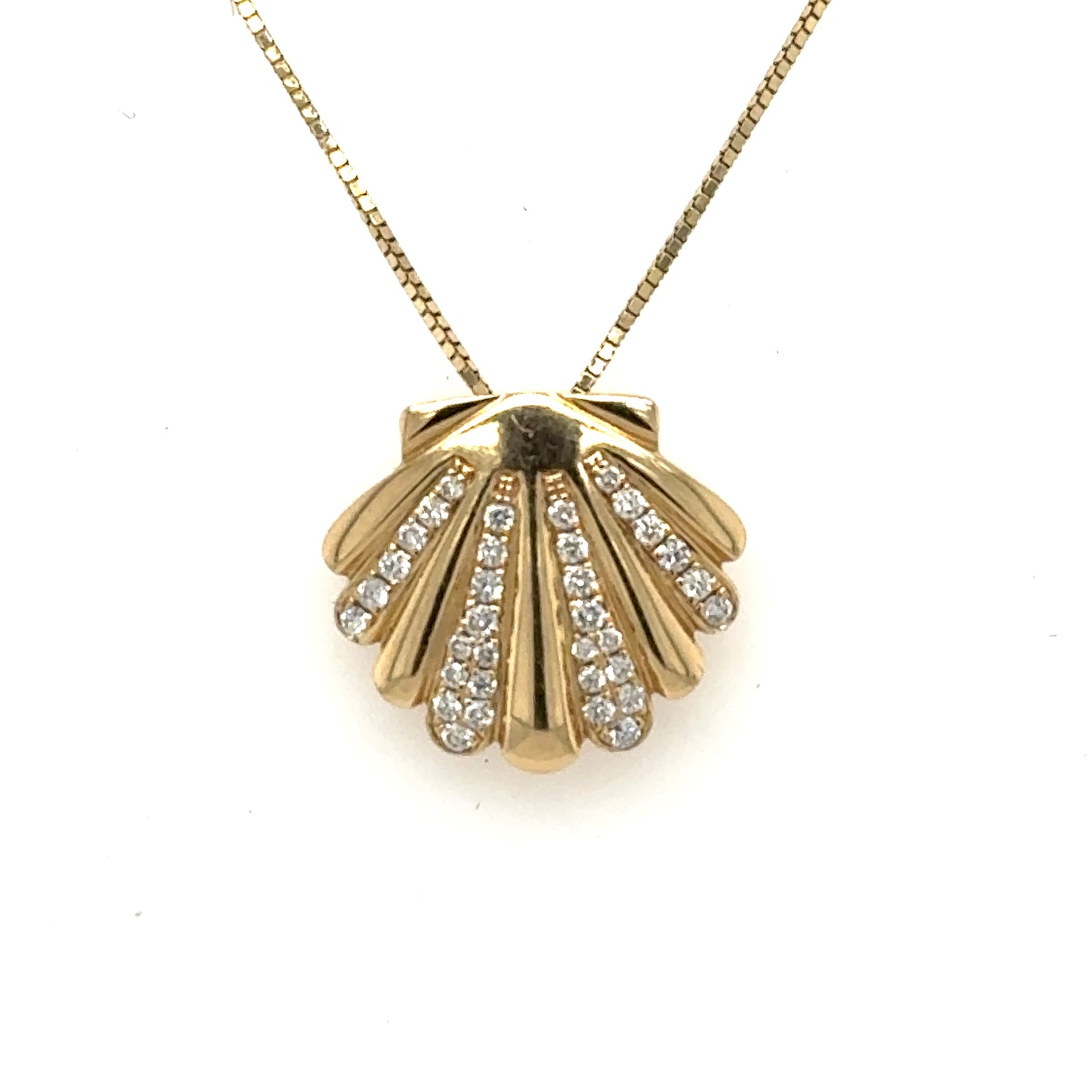 Yellow gold seashell pendant with pavé diamond ribs on a box chain.