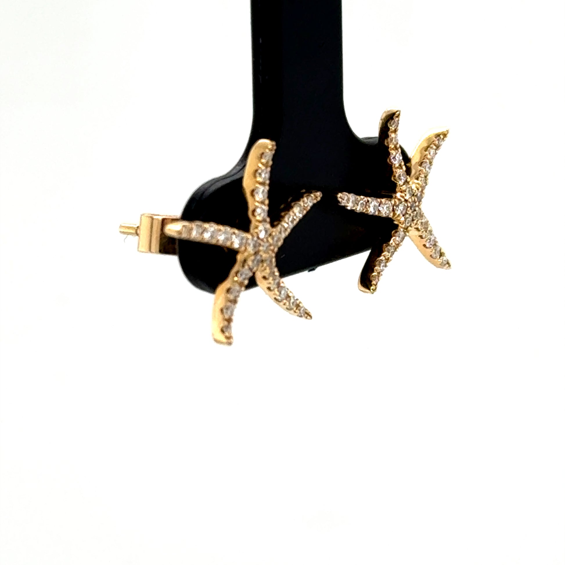 14K yellow gold starfish stud earrings pavé-set with round white diamonds.