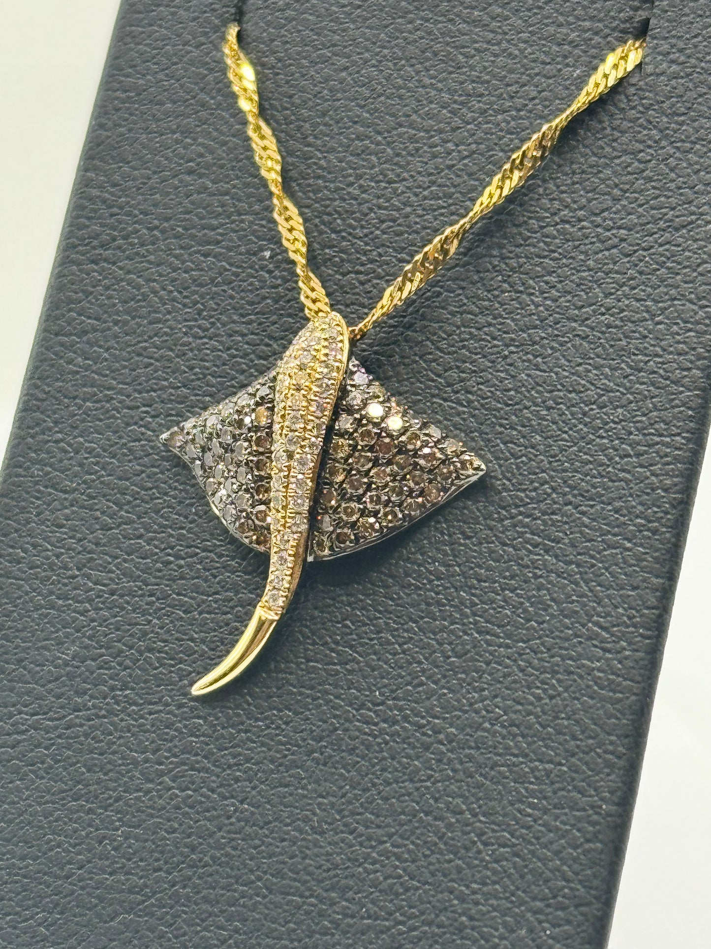 14K yellow gold stingray pendant with white and chocolate pavé diamonds.