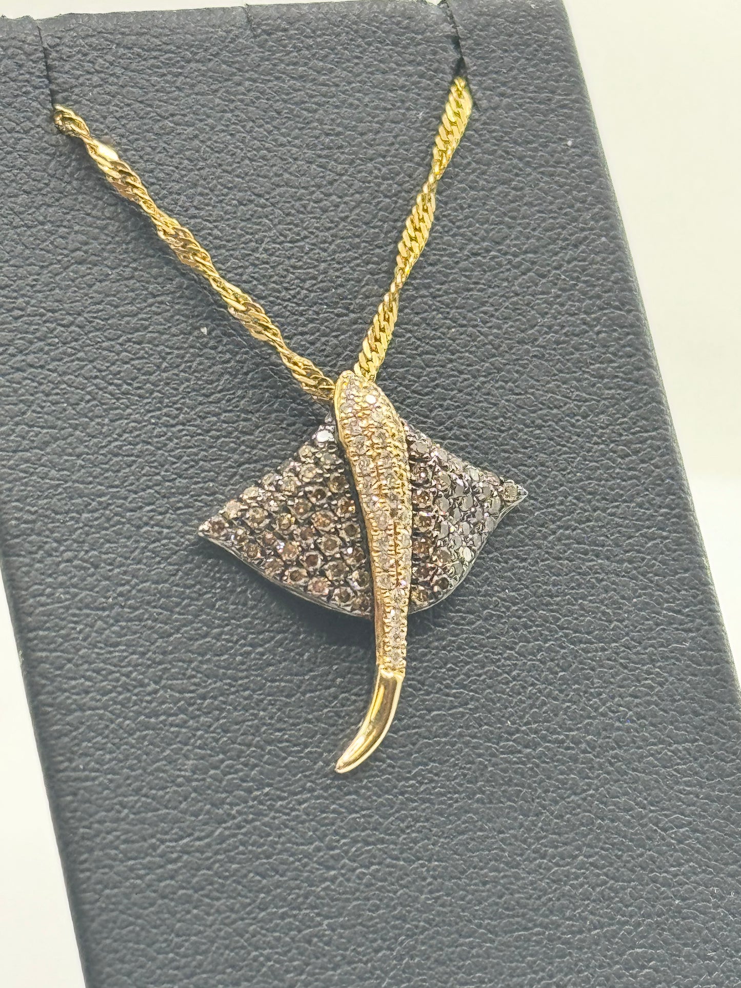 14K yellow gold stingray pendant with white and chocolate pavé diamonds.
