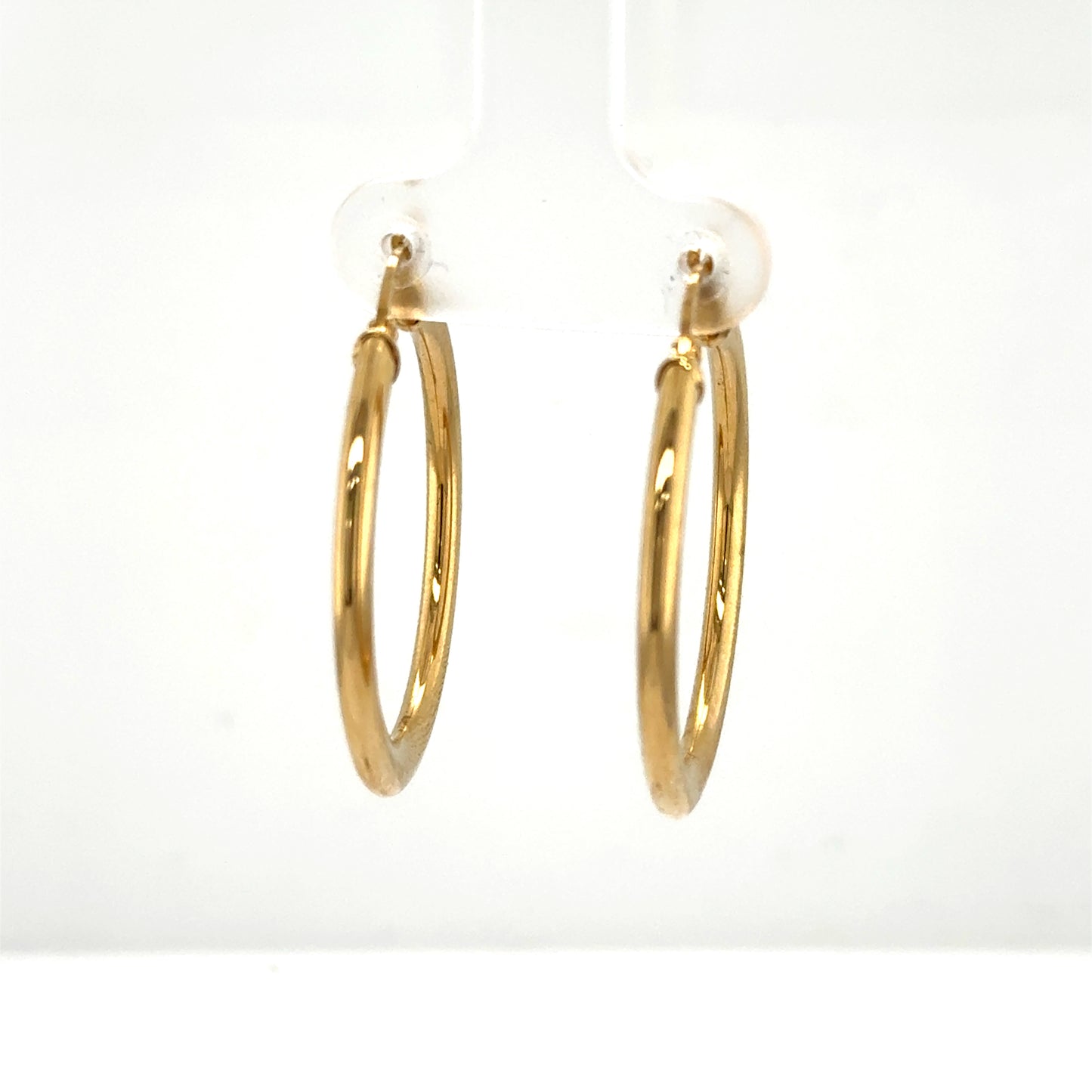 Pair of polished 14K yellow gold tube hoop earrings with latch backs.