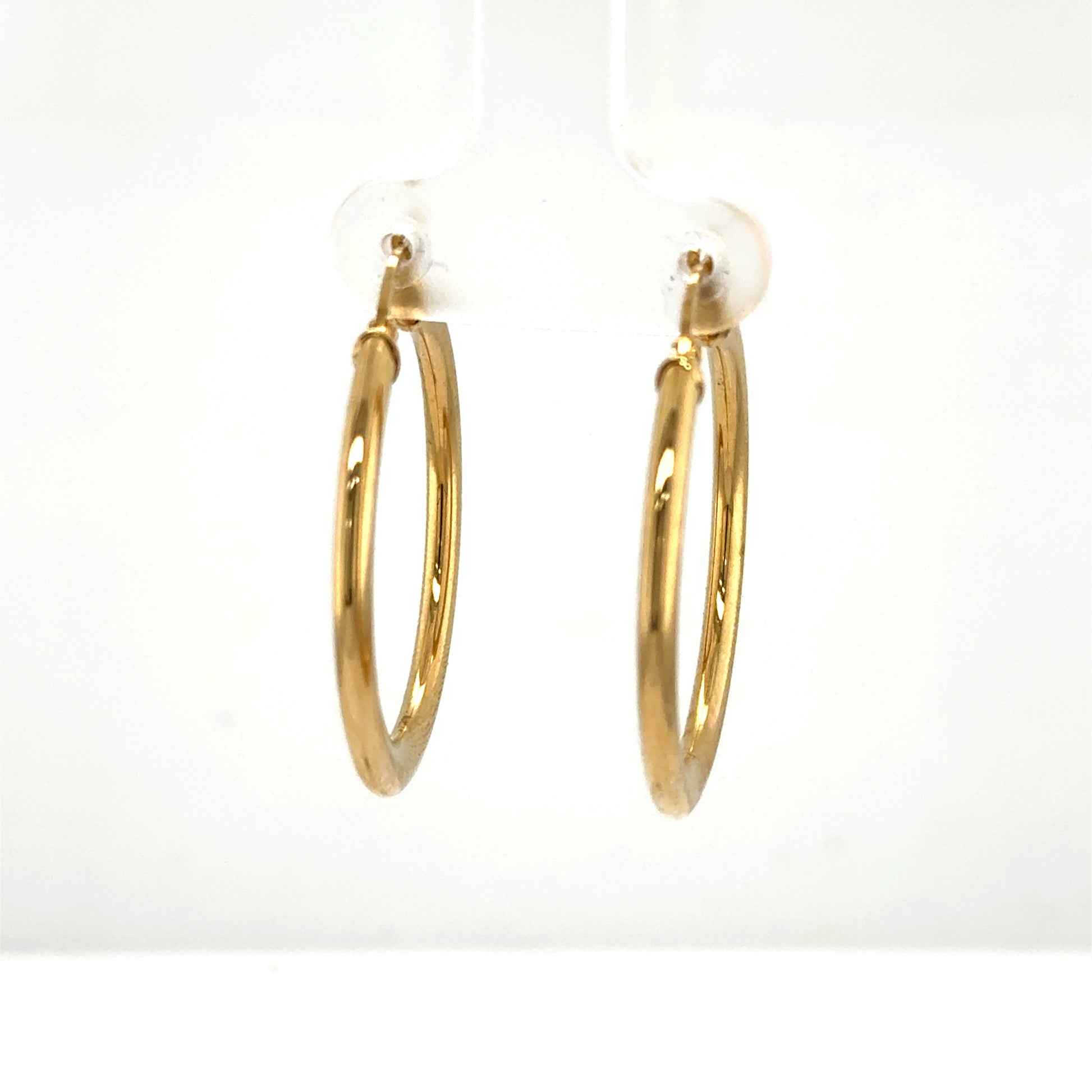 Pair of polished 14K yellow gold tube hoop earrings with latch backs.